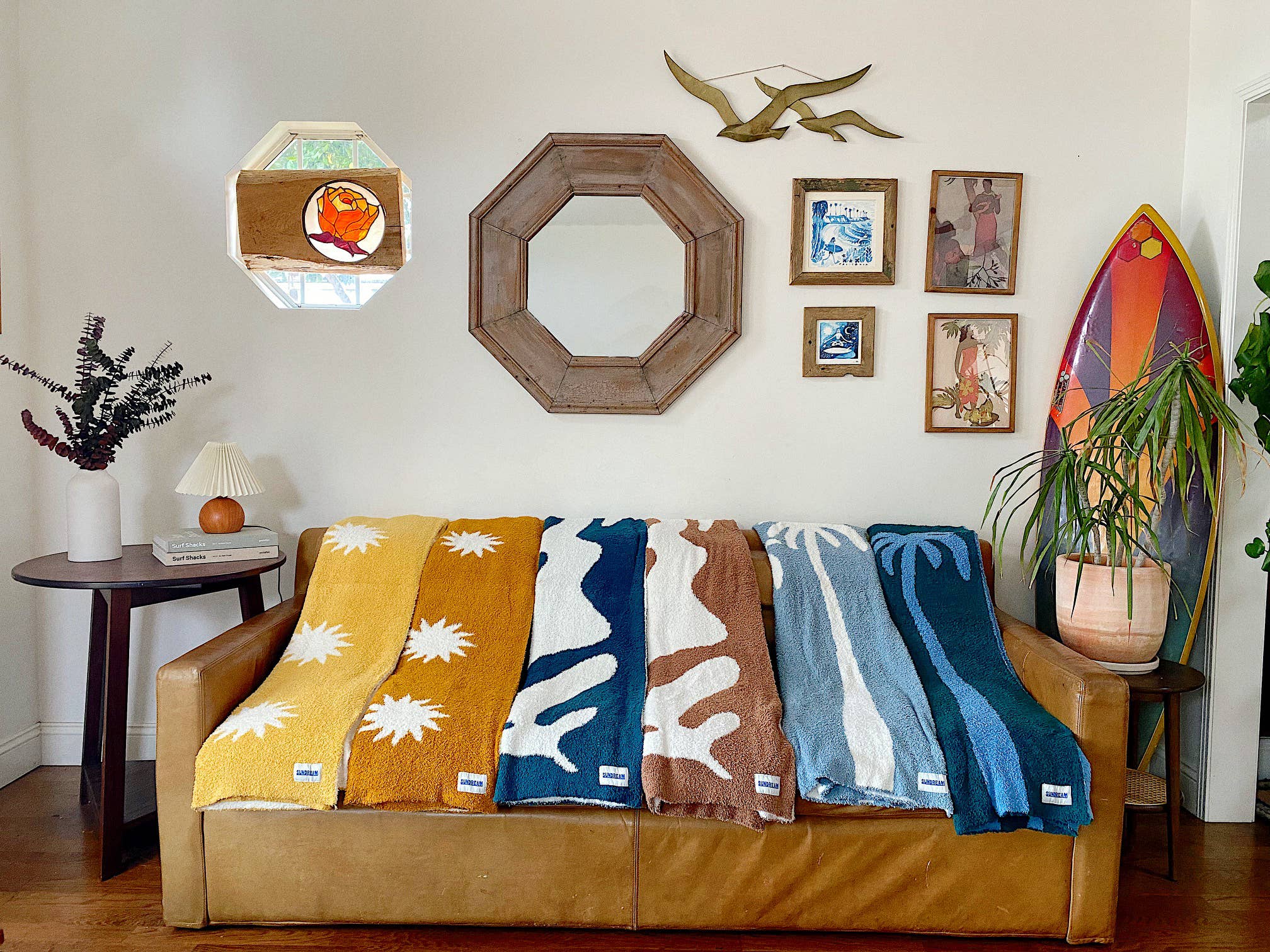 Soft brown plush throw blanket with a sun and palm tree design, perfect for adding warmth and a stylish accent to any space.