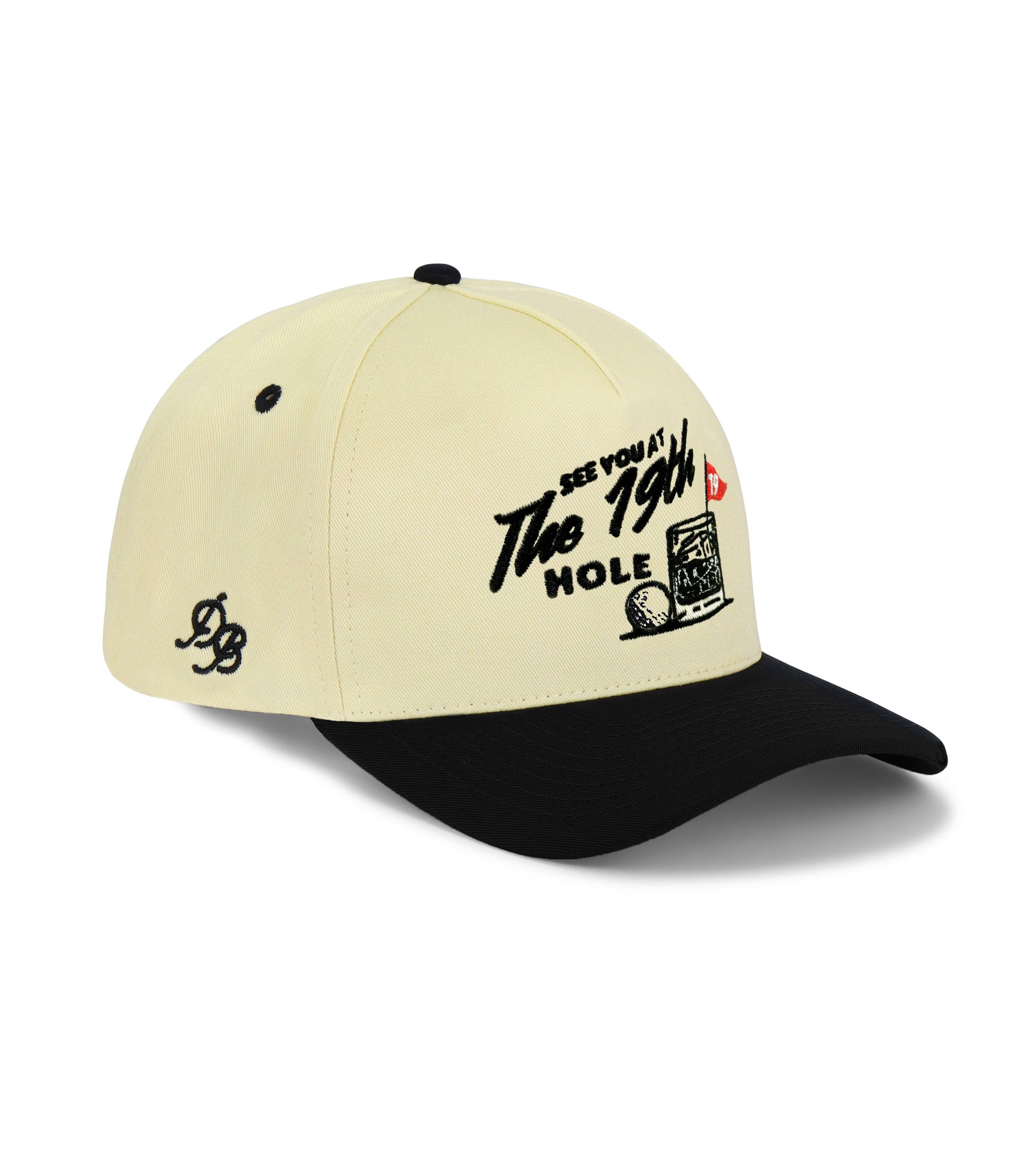 Beige and black cap with text and graphics on a white background