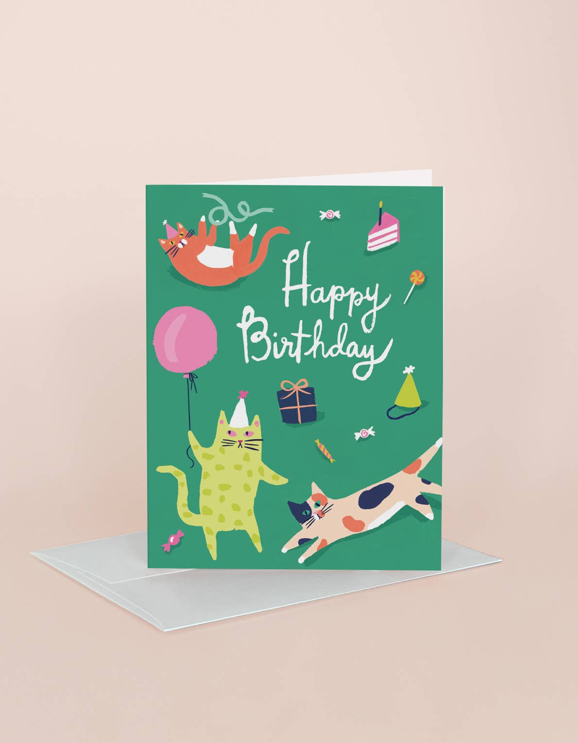 Birthday card with cats and party elements on a green background