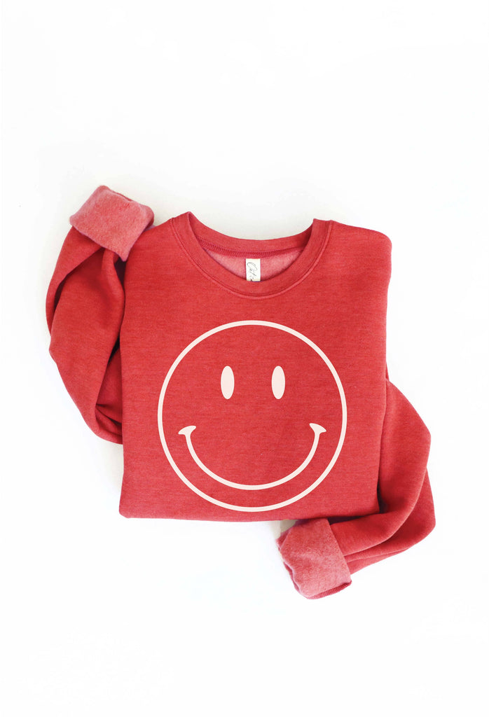Smiley Face Sweater: Yellow sweater with a large smiley face design.