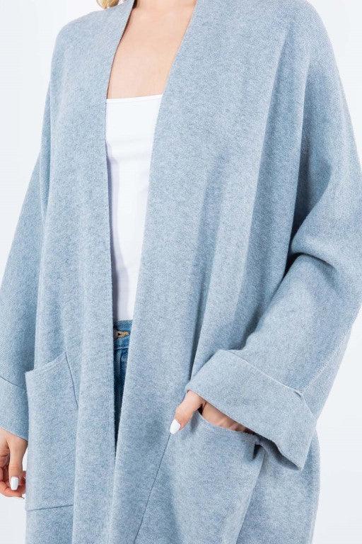 Olivia Cardigan showcasing its open-face design, lightweight knit fabric, and ribbed detailing, ideal for effortless and stylish layering.