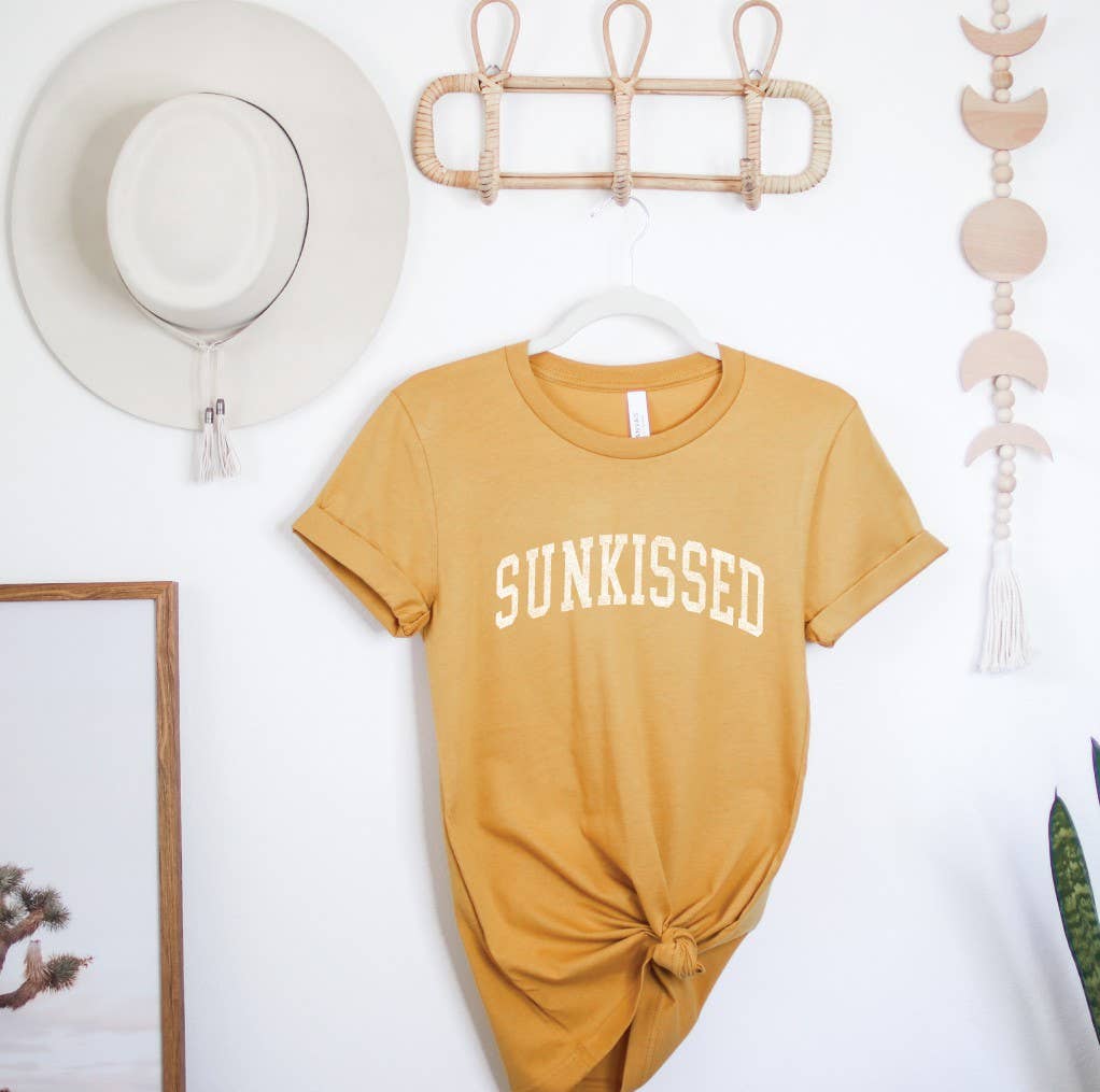Sunkissed T-Shirt: White shirt with a large sun design.