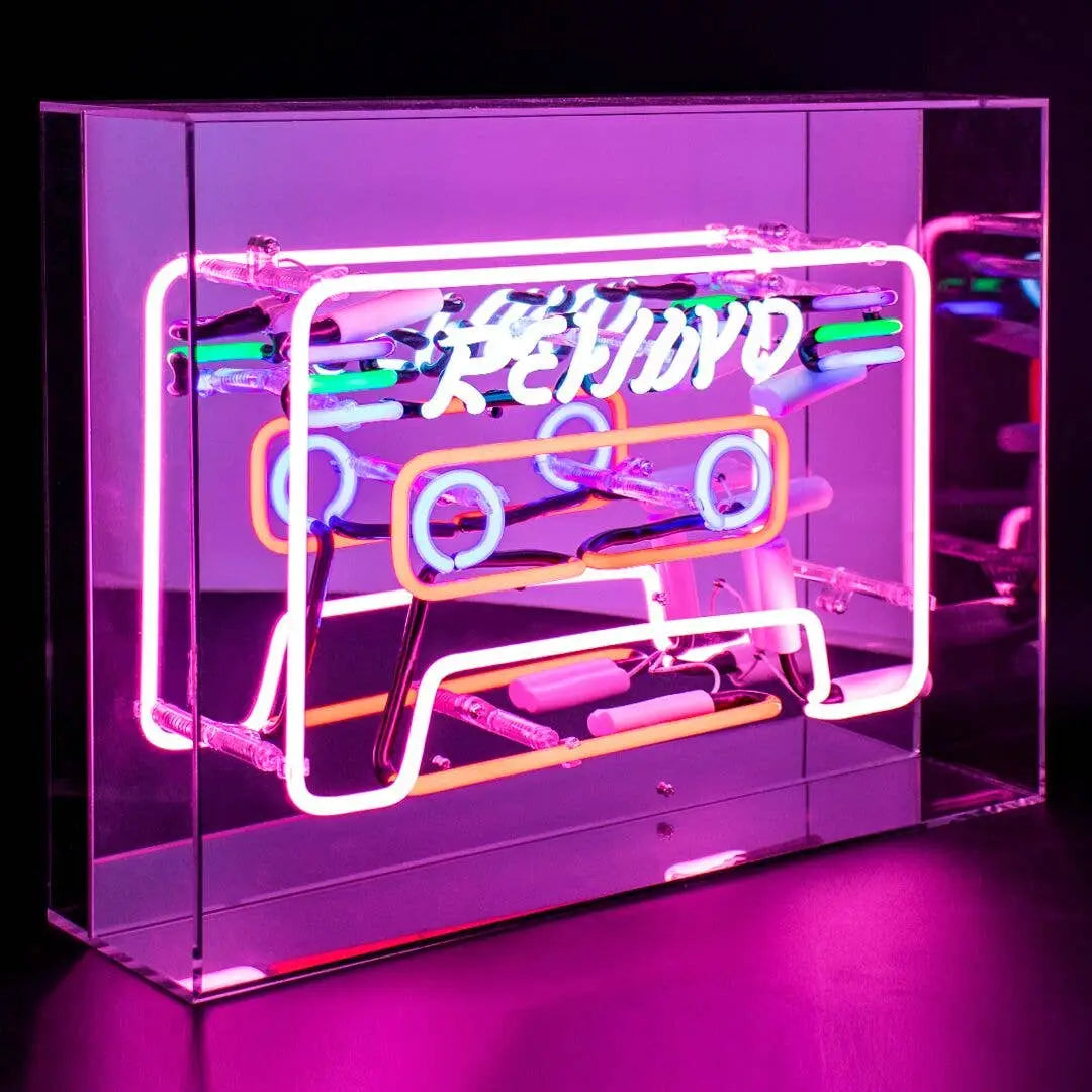 Vibrant Neon 'Cassette' Light in shades of blue, red, green, and pink, encased in a glossy acrylic box with a mirror back, making a striking retro statement.