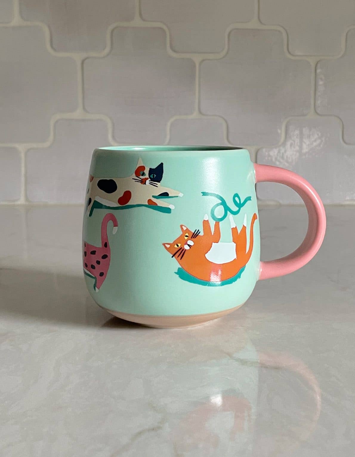 FORMA Ceramic Cats Mug - Whimsical cat illustrations for charming coffee moments.