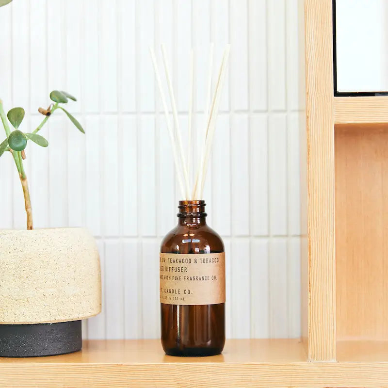 P.F. Candle Teakwood & Tobacco Diffuser - A carefully crafted diffuser with the rich and earthy aroma of teakwood and tobacco.