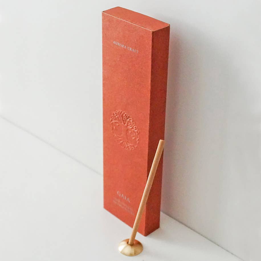 Gaia natural incense sticks in a terracotta box with an embossed tree design and built-in holder for relaxation and grounding.