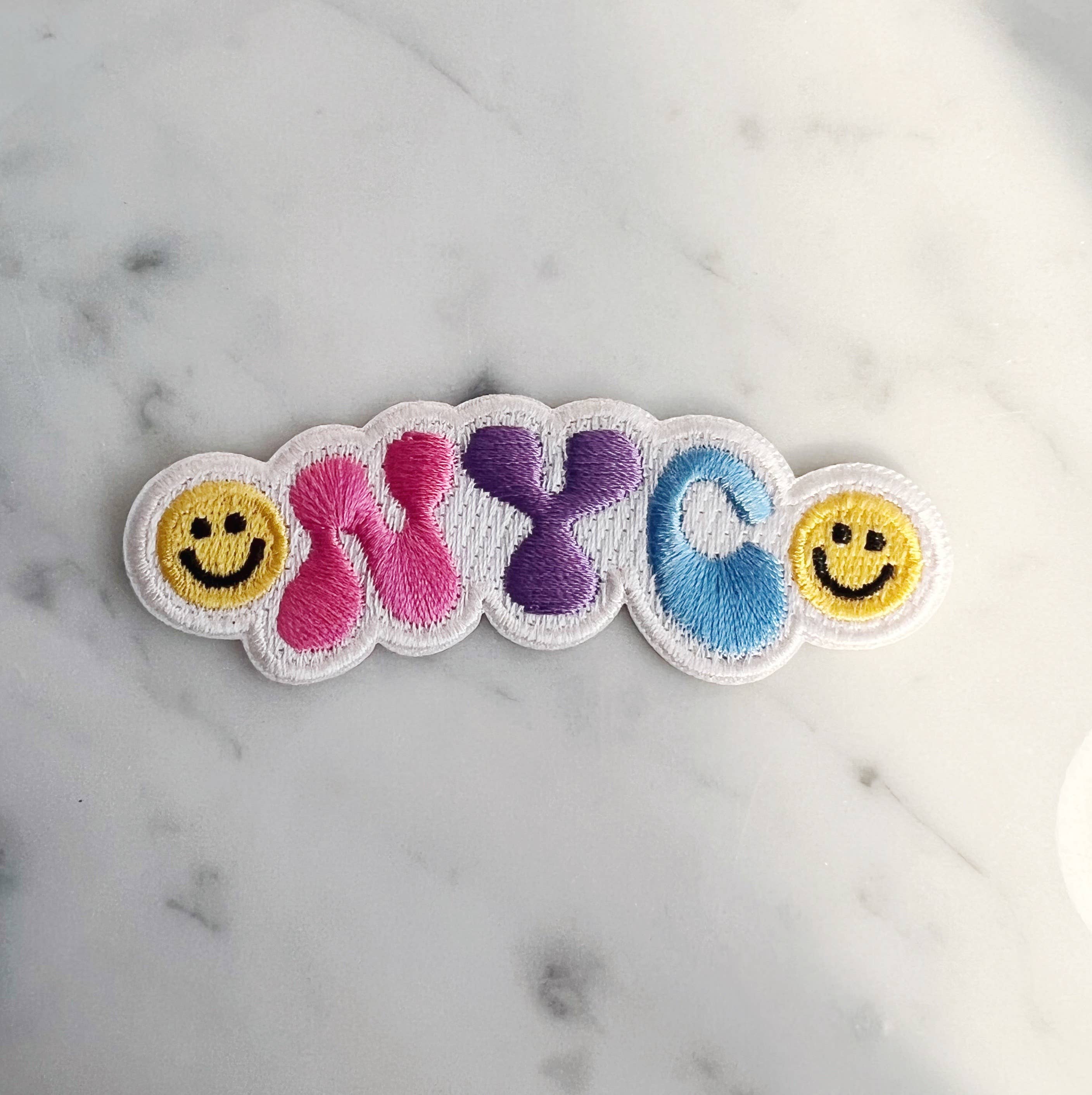 NYC Smiley Patch featuring a cheerful smiley face with the NYC skyline.