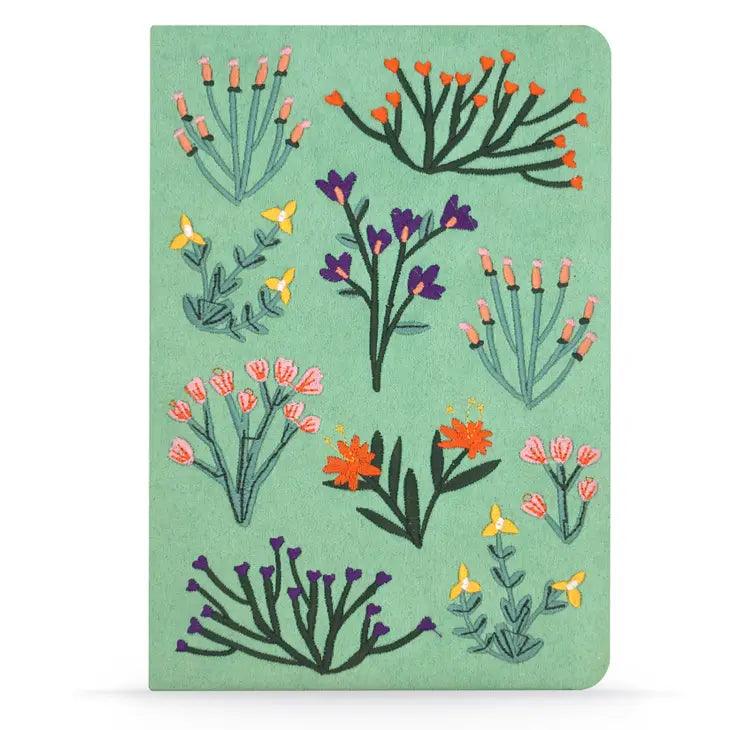 Intricate flower embroidery on a soothing green cover of the Green Flower Embroided Notebook.