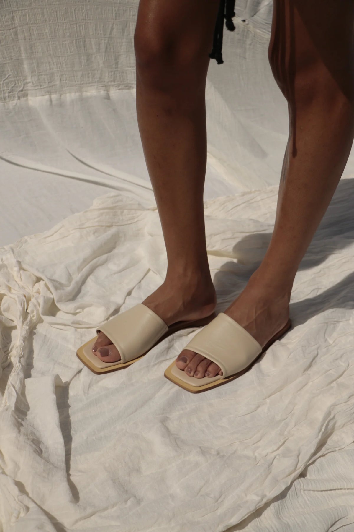 Lenny Sandals displayed in both suede and leather options, showcasing their luxurious materials and classic design.