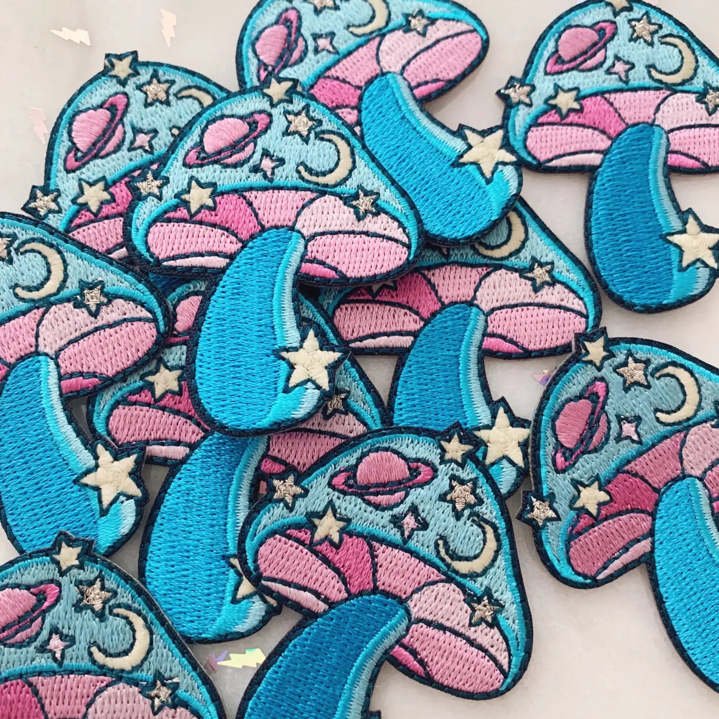 Cosmic Mushroom Patch, blending a detailed mushroom design with a mesmerizing cosmic backdrop, symbolizing the fusion of nature and the universe.