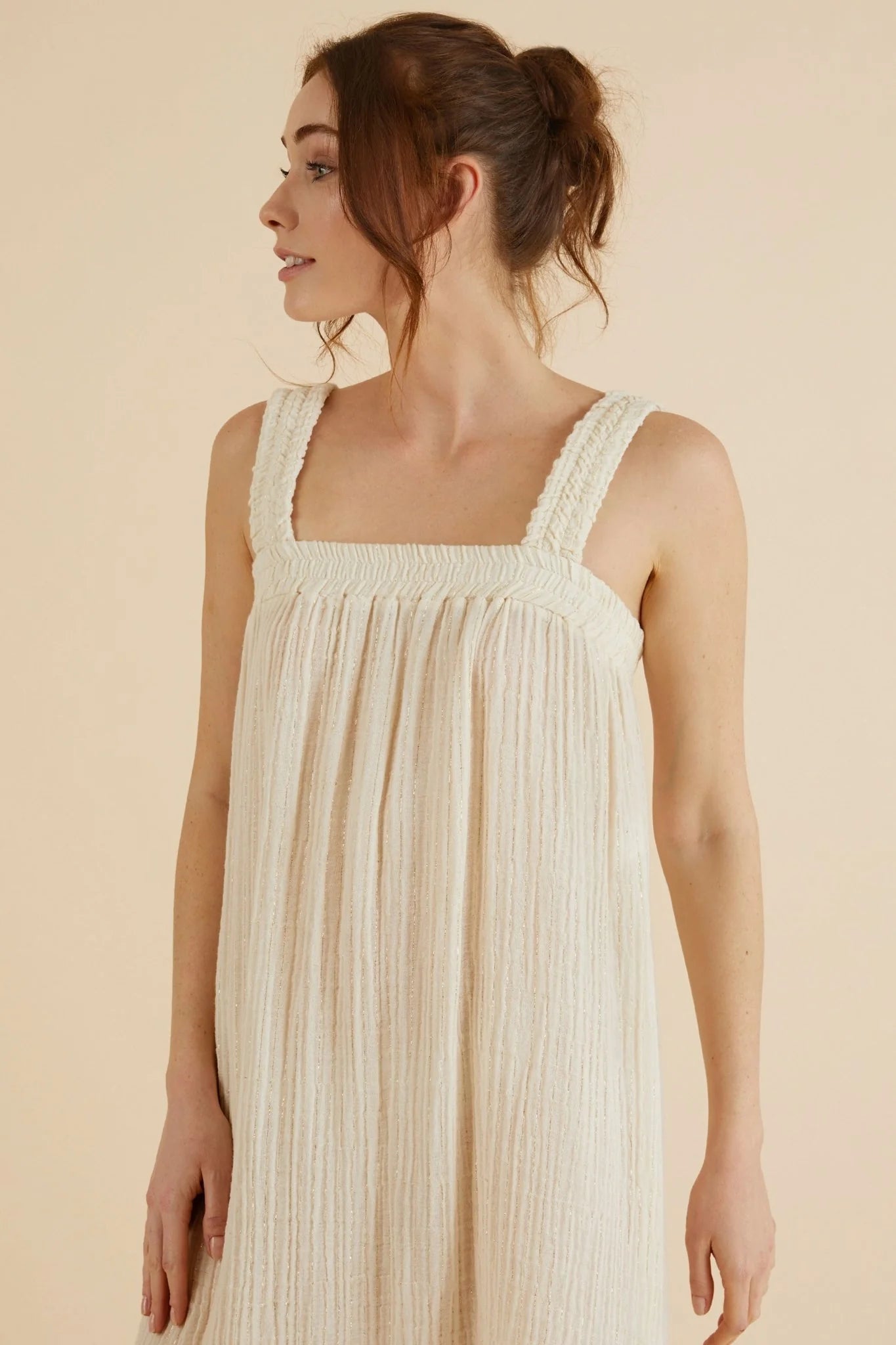 The Noa Straps Maxi Dress, made from 100% Turkish cotton, elegantly displayed, showcasing its delicate straps and flowing maxi length.
