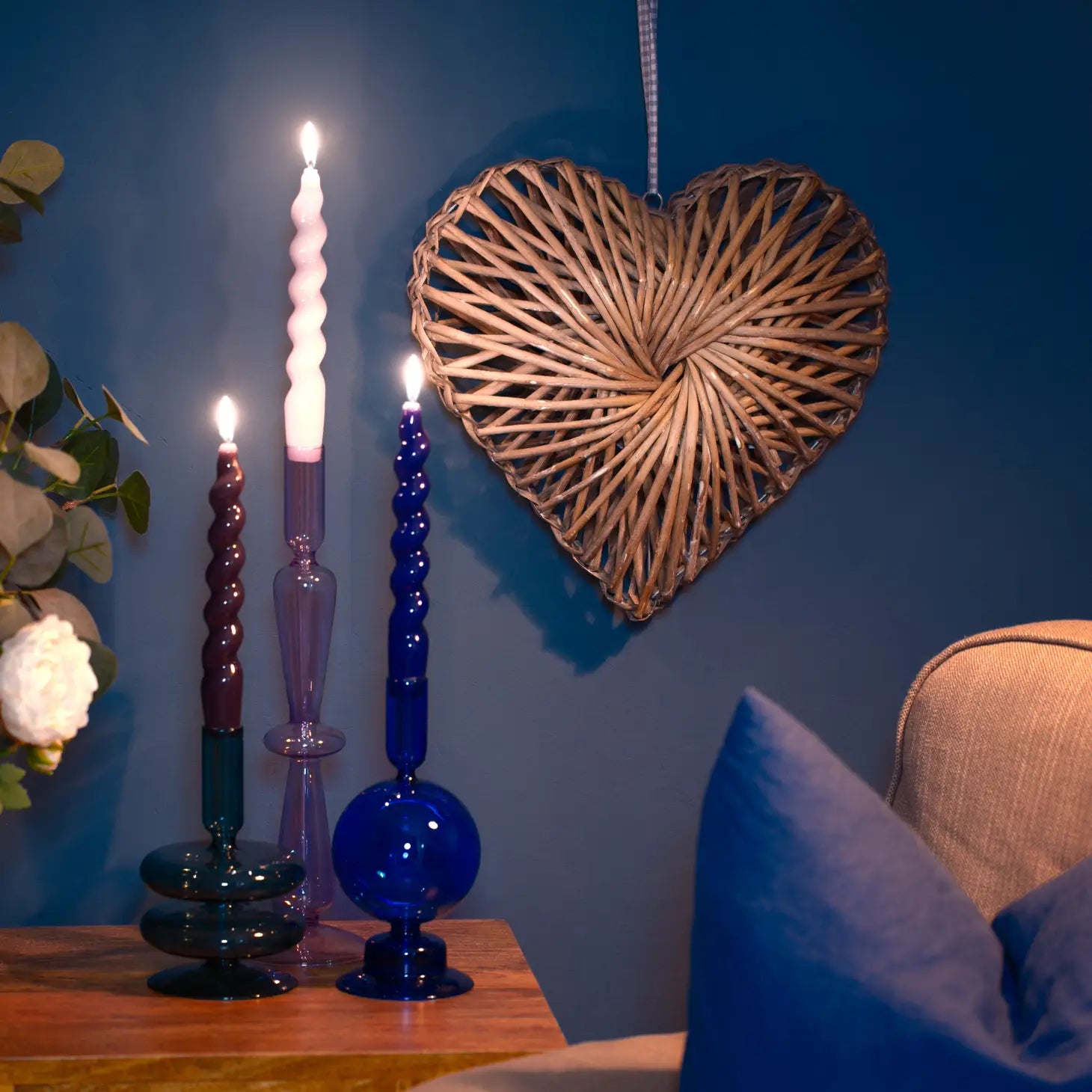 Ocean Teal Coloured Glass Taper Holder, reflecting a calming, sea-inspired glow.