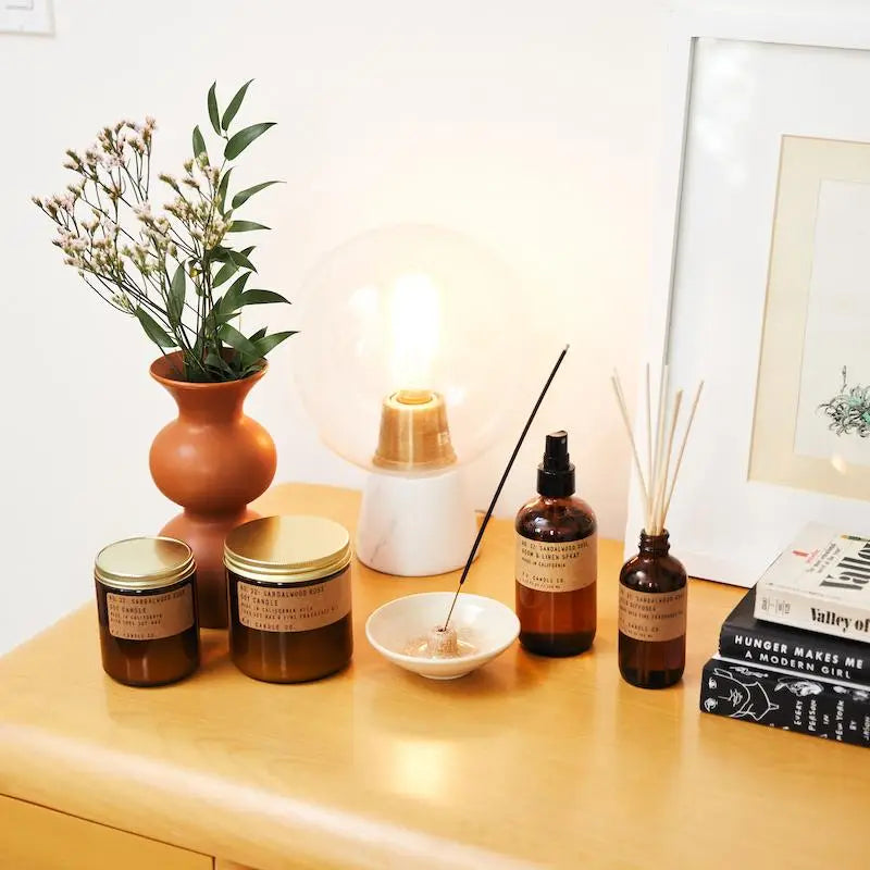 Sandalwood Rose Soy Candle in sustainable packaging, releasing a calming blend of sandalwood and rose fragrances.