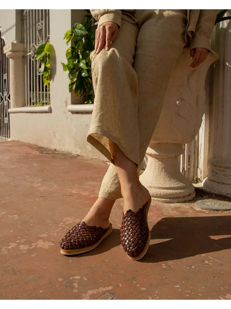 UXMAL sandals, meticulously crafted from 100% premium leather, positioned against a backdrop reflecting Mayan brilliance.
