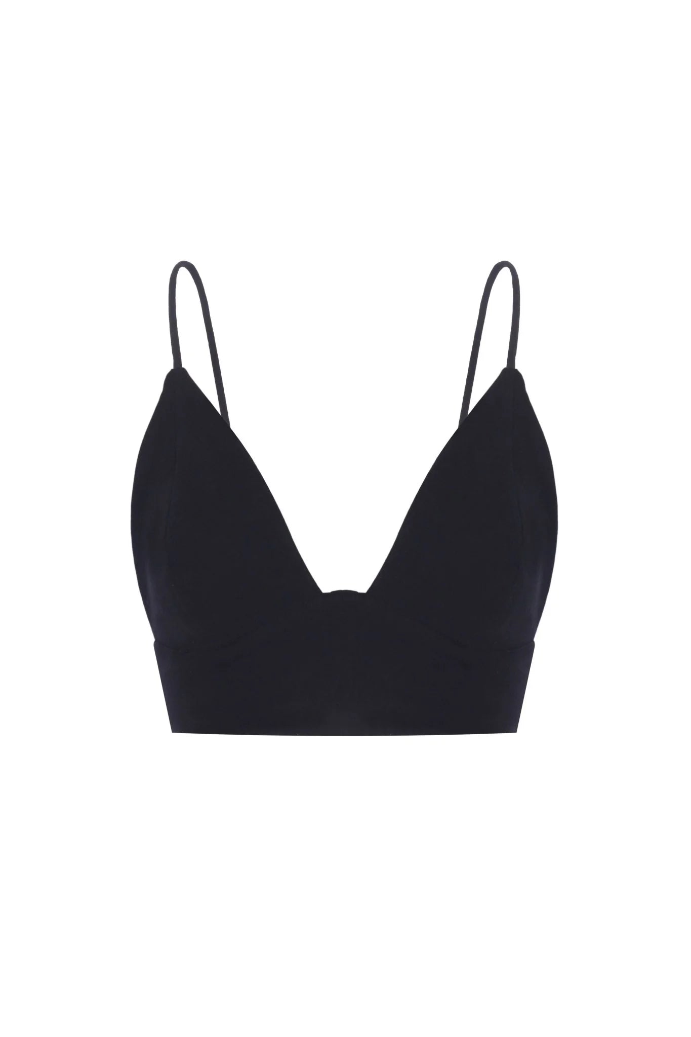 A woman wearing the Sundown Top, showcasing its relaxed fit, short sleeves, and flattering neckline, a versatile and stylish option for any occasion.