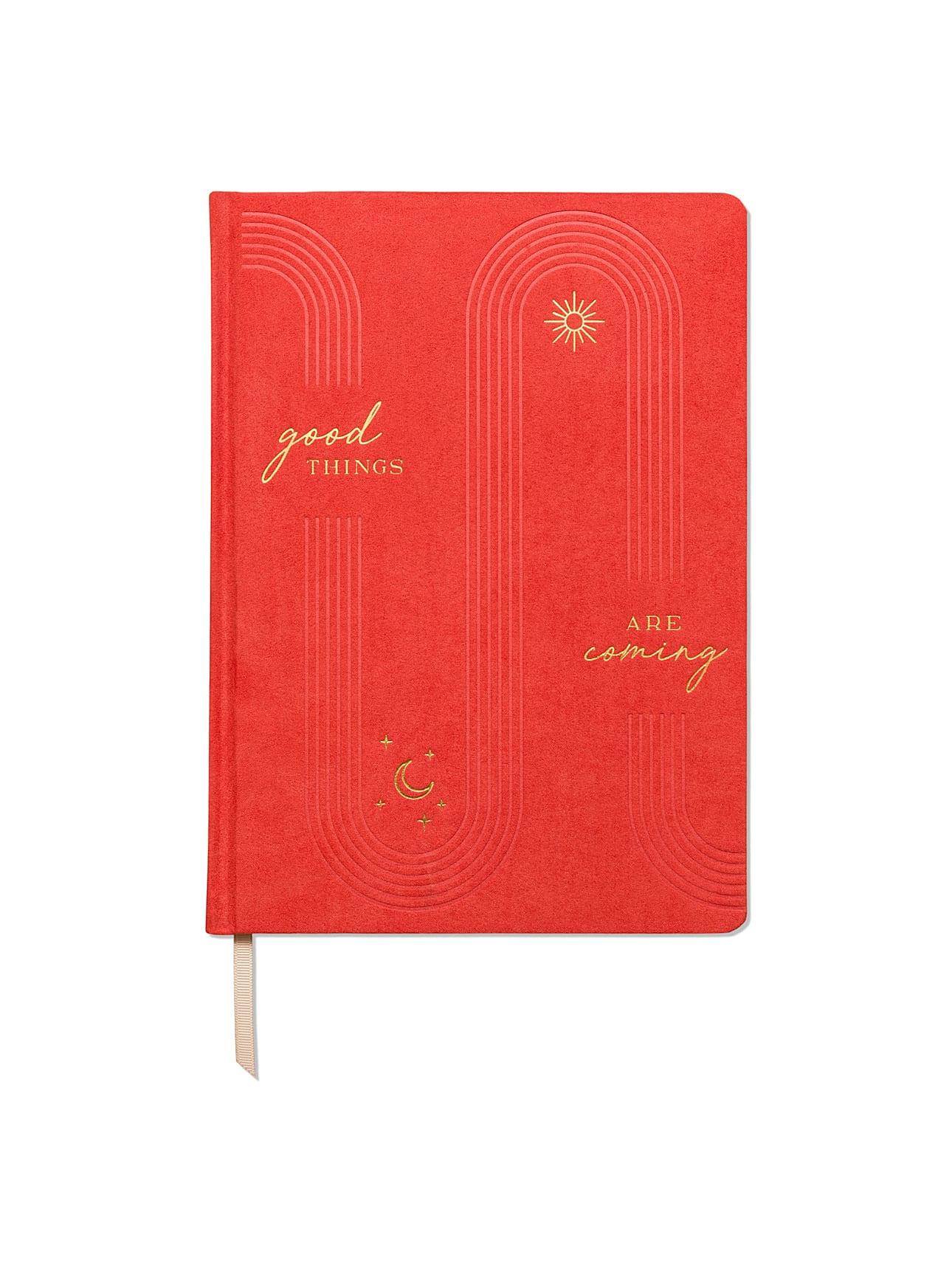 Image showcasing the 'Good Things Cloth Covered Journal', with an attractive fabric cover design.