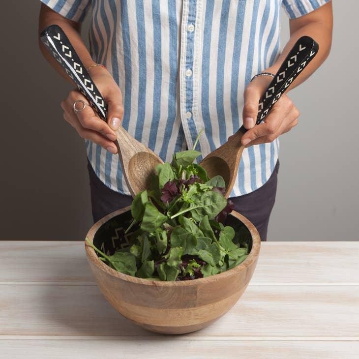 Ziggy Mango Wood Serving Utensil - Elegant serving utensils with white abstract design and mango wood handles, ideal for meal presentations.