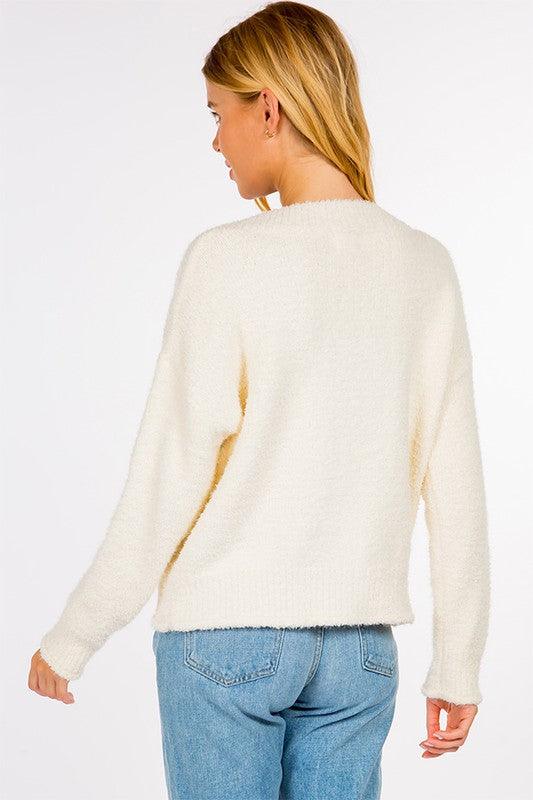 Evelyn Sweater featuring a classic design and soft, warm fabric, ideal for a comfortable and stylish outfit.