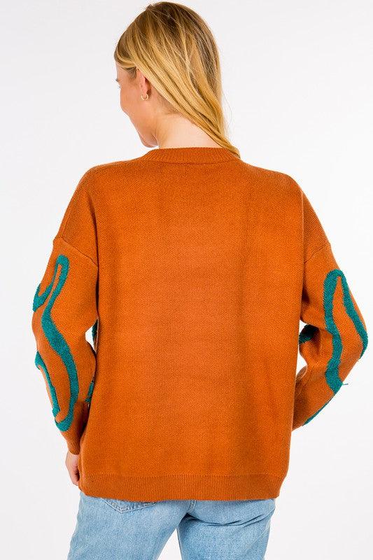Dinosaur Sweater featuring cute dinosaur motifs on a comfortable, warm fabric, perfect for adding a fun element to your outfit.