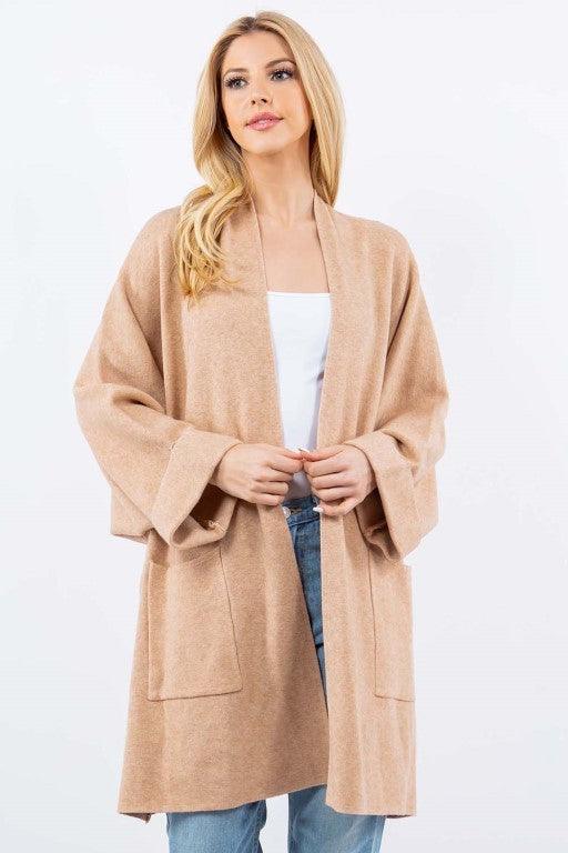 Olivia Cardigan showcasing its open-face design, lightweight knit fabric, and ribbed detailing, ideal for effortless and stylish layering.