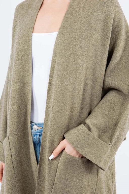 Olivia Cardigan showcasing its open-face design, lightweight knit fabric, and ribbed detailing, ideal for effortless and stylish layering.
