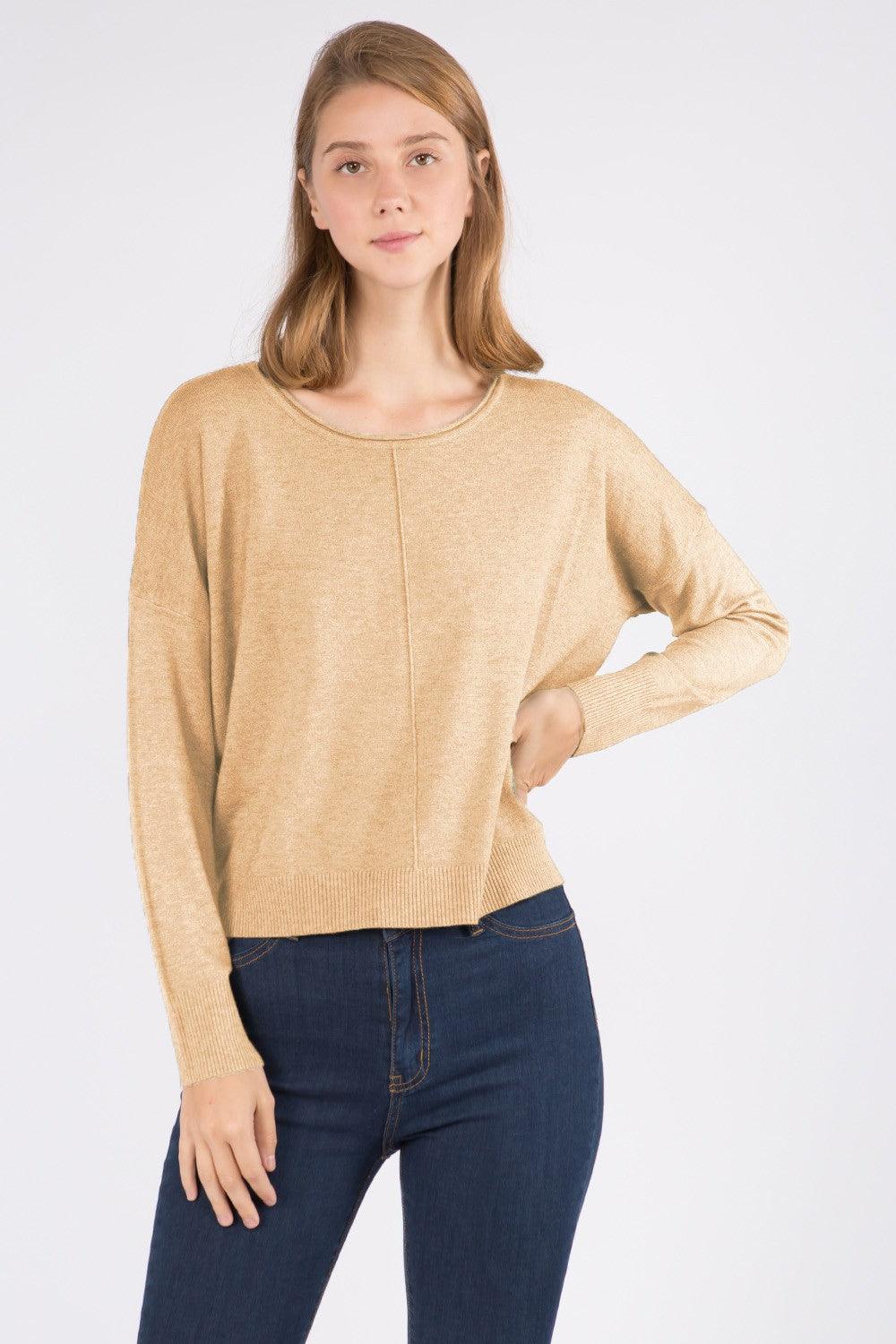 Sarah Sweater showcasing its luxurious fabric blend and versatile design, perfect for a sophisticated and comfortable look.