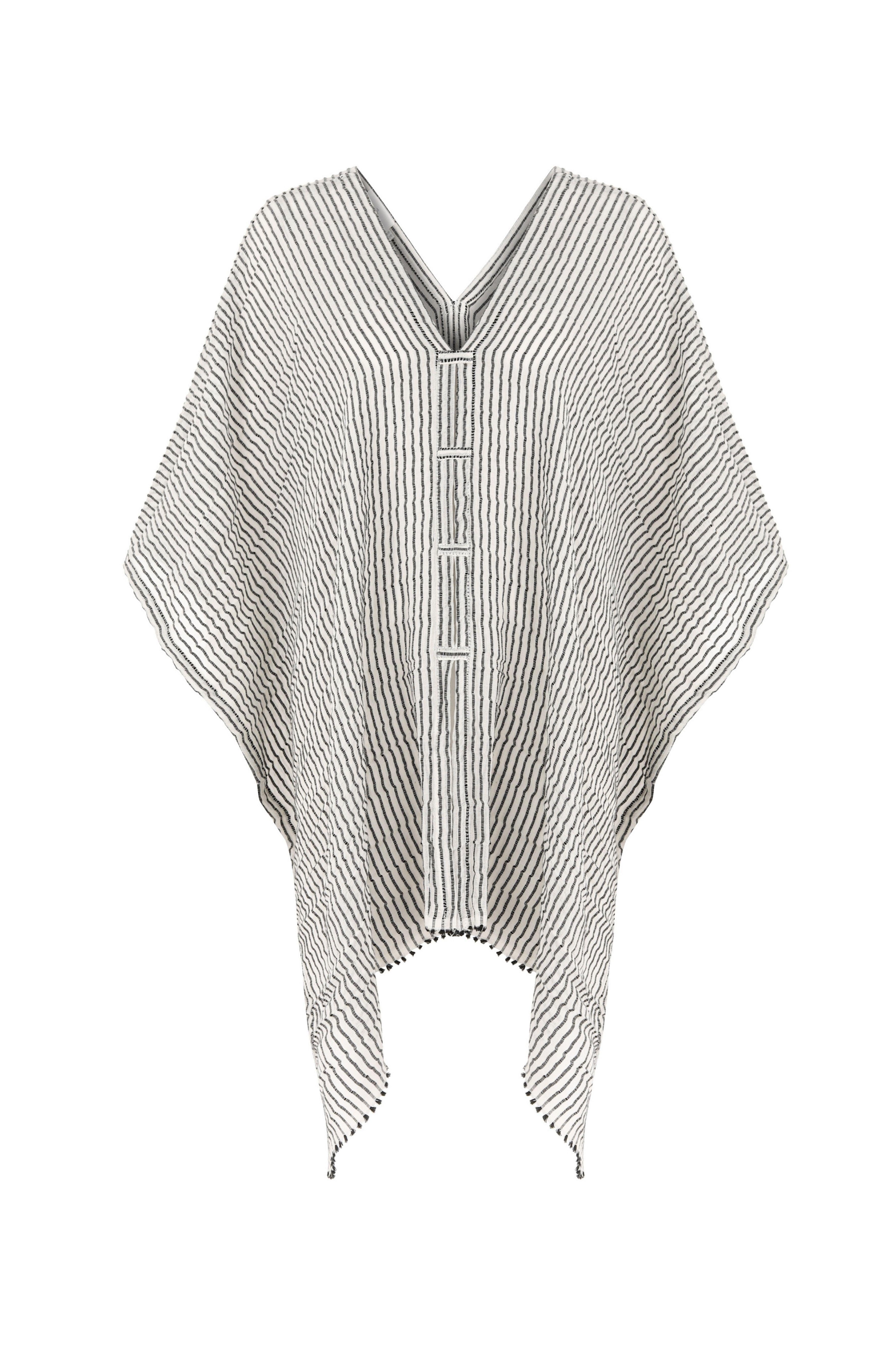A woman gracefully wearing the Ava Kimono, showcasing its flowing silhouette, delicate patterns, and high-quality fabric.