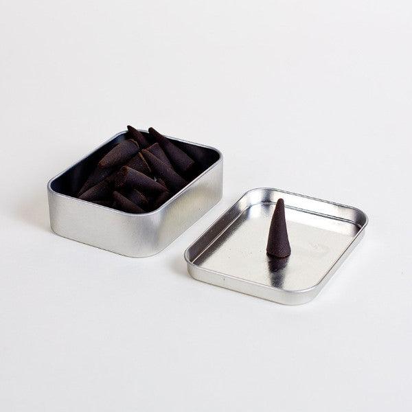 Yosemite Incense sticks set against a backdrop of dramatic cliffs and misty waterfalls, embodying the product's energetic and mysterious aroma.