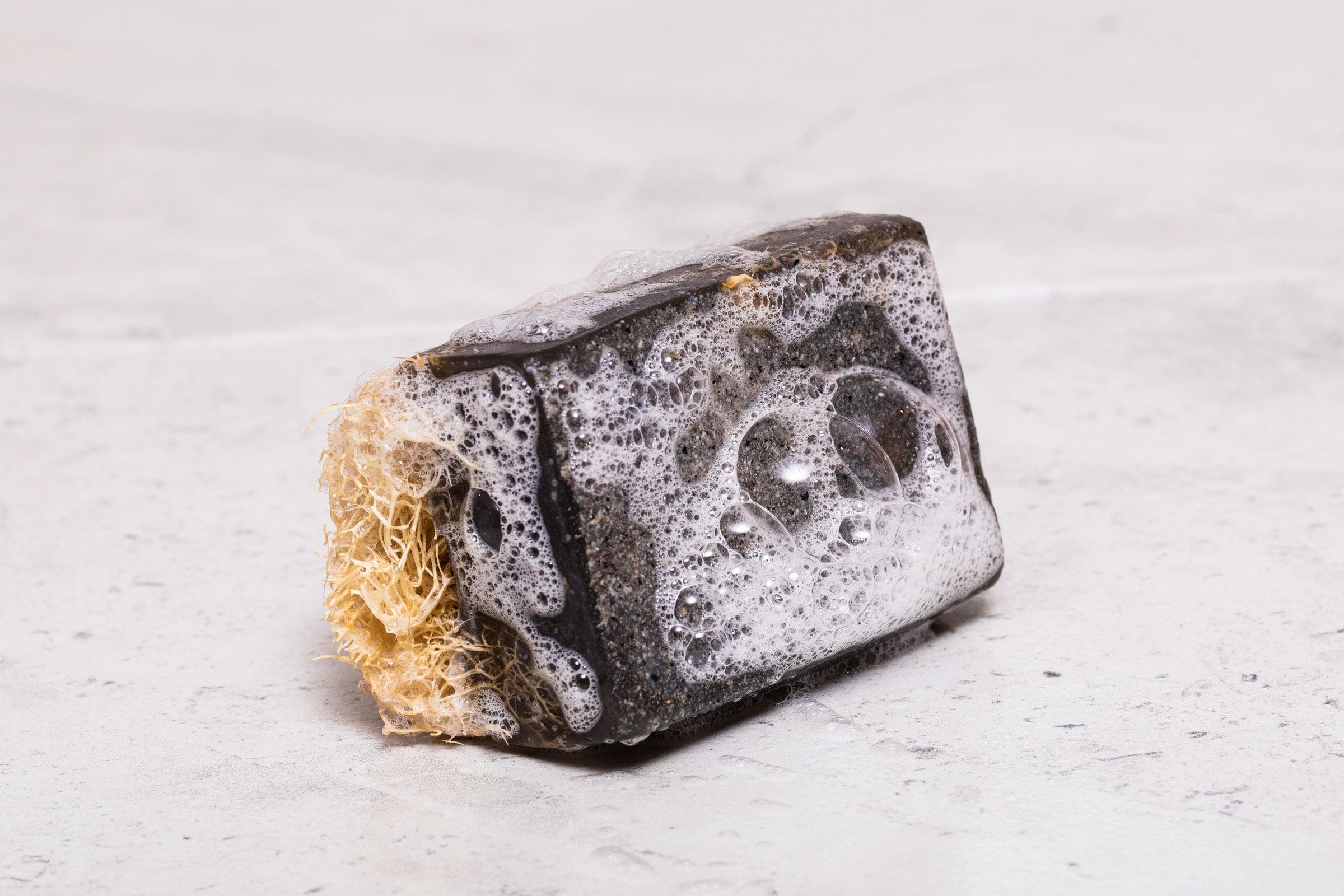 The Phoenix Charcoal Loofah Soap, combining detoxifying charcoal and natural loofah for deep cleansing.