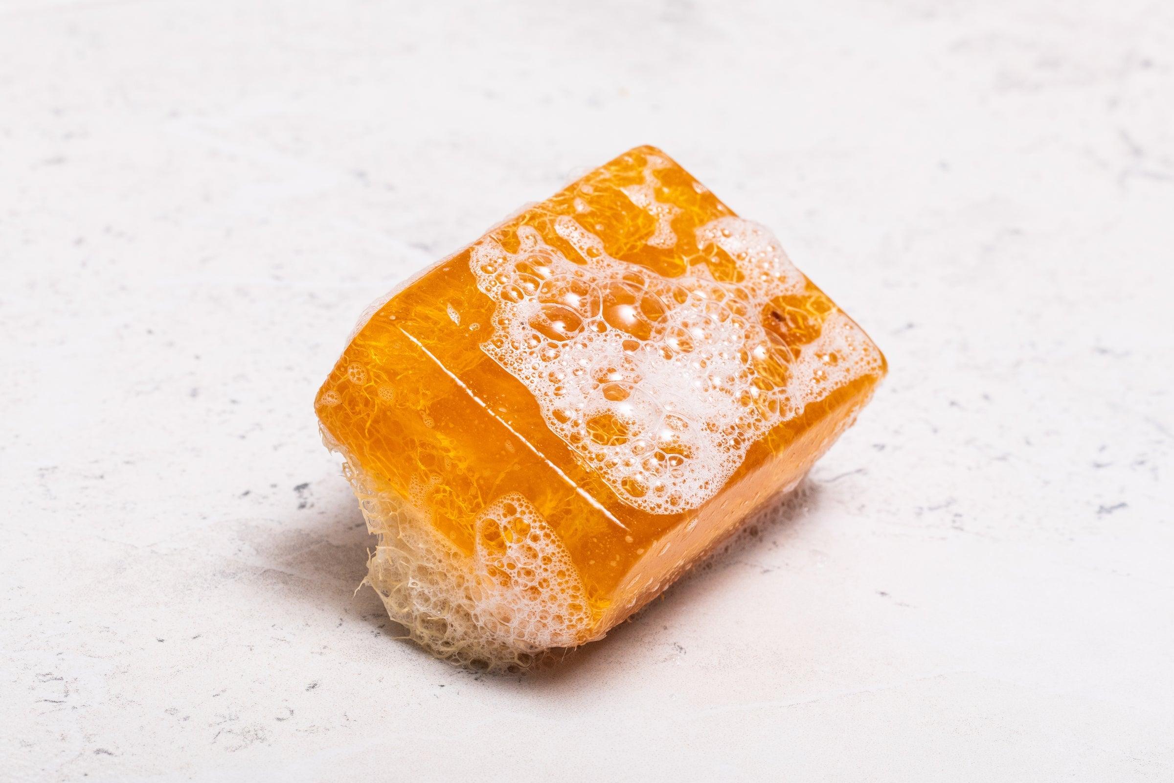 Lemon-scented Natural Handmade Loofah Soap Bar, perfect for refreshing exfoliation.