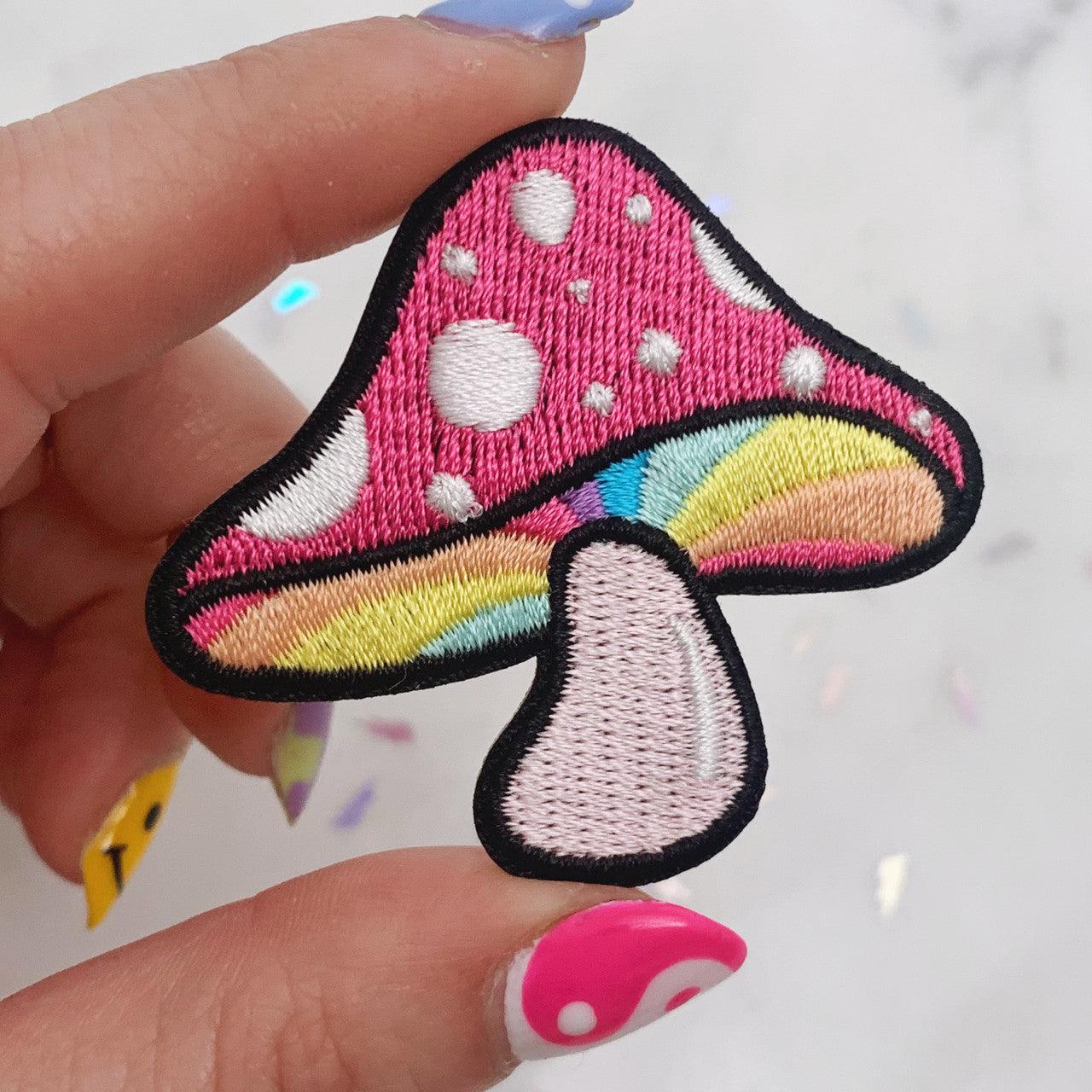 Embroidered patch featuring a colorful and intricate mushroom design reminiscent of magical realms.