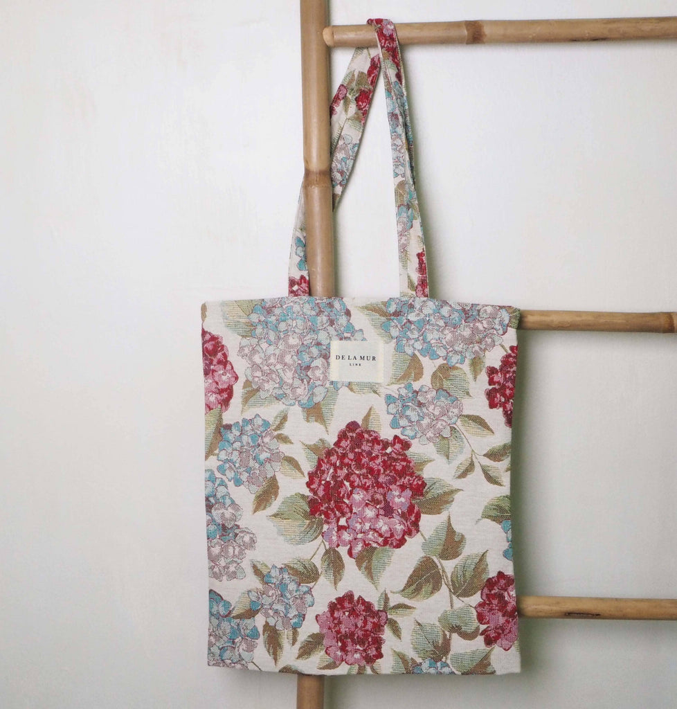 Flower Tote Small made from robust materials, showcasing a delicate flower design with ideal balance of space