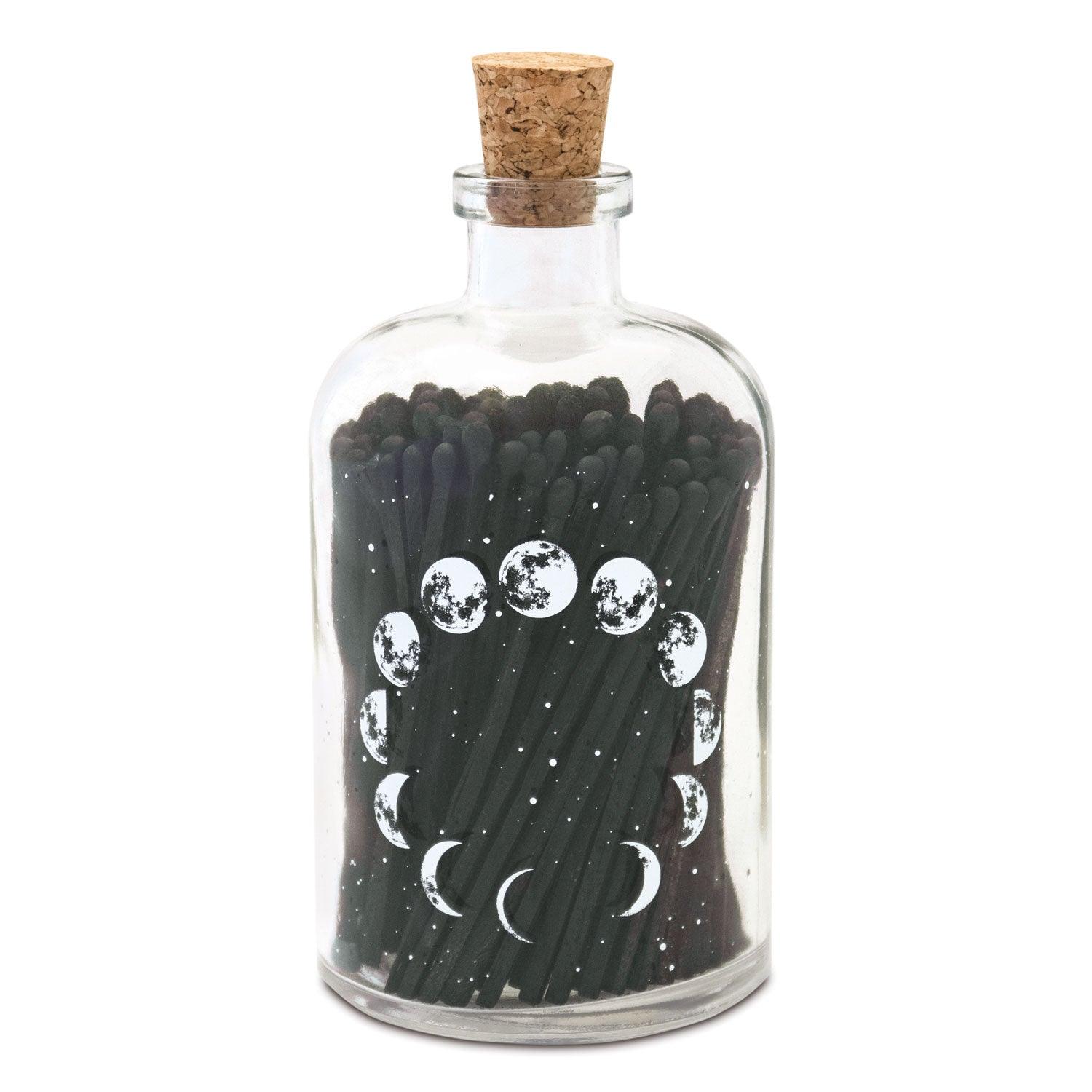 Moon Phase Matches in a stylish matchbox, featuring a celestial design of moon phases, perfect for lighting candles or fires.