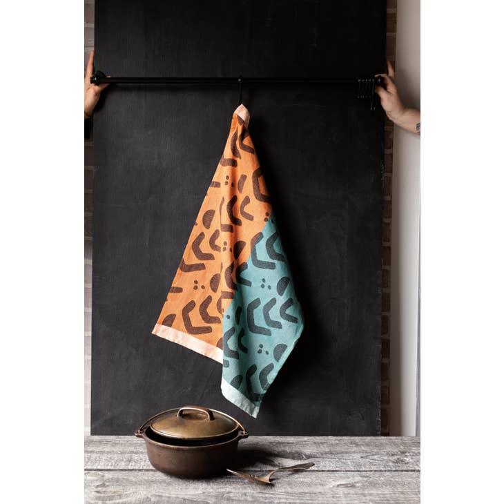 Echo Woven Cotton Dishtowel, with a minimalist design, displayed neatly on a kitchen countertop.