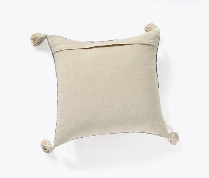 Image of the 'Handmade Printed Persian Cotton Pillow Cover', highlighting its soft, fluffy texture, the handmade tassels at each corner, and the intricate printed design.