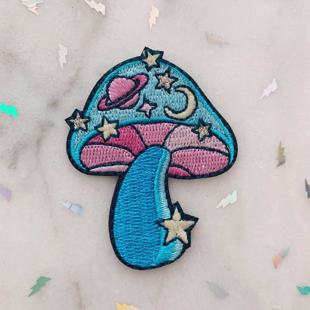 Cosmic Mushroom Patch, blending a detailed mushroom design with a mesmerizing cosmic backdrop, symbolizing the fusion of nature and the universe.