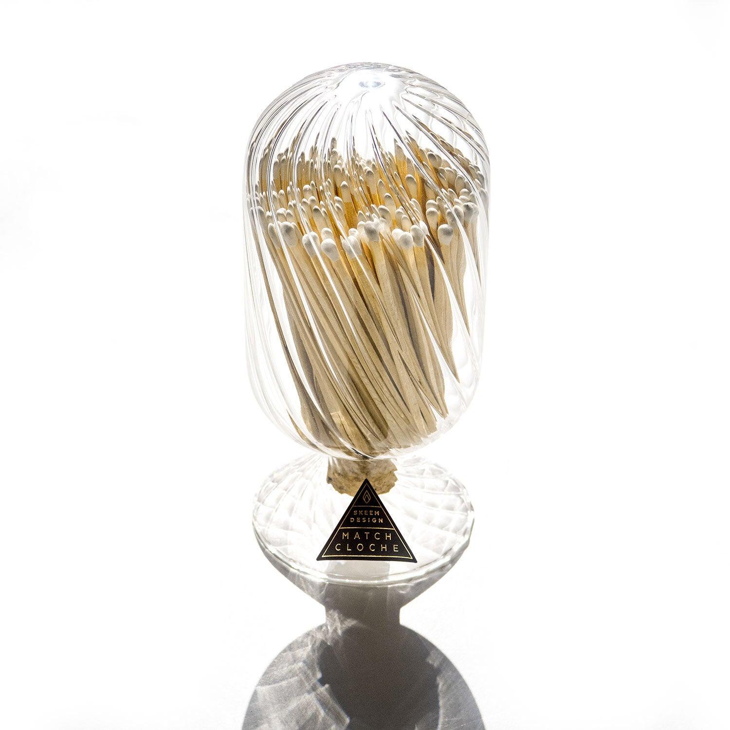 White Helix Match Cloche, a stylish glass container with a mesmerizing white helix design, perfect for match storage and display.