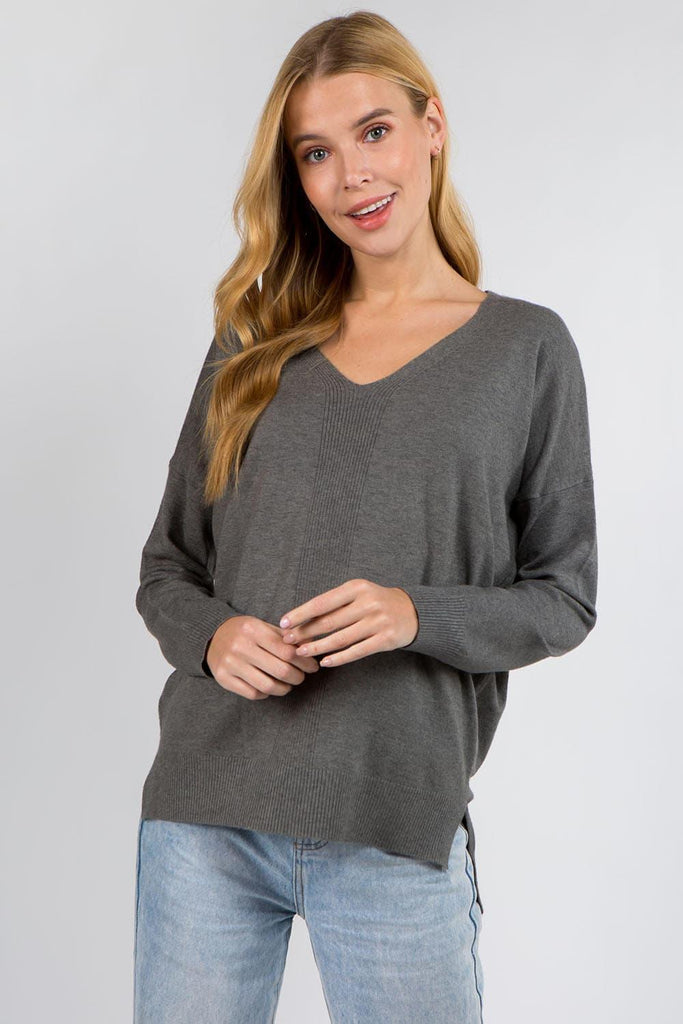 Vanessa Sweater showcasing its soft and luxurious fabric with a ribbed pattern, perfect for a stylish and comfortable outfit.