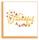 Card with 'Thankful' text surrounded by autumn leaves on a white background