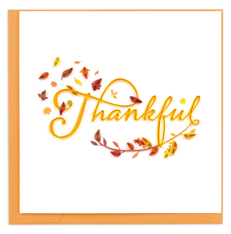 Card with 'Thankful' text surrounded by autumn leaves on a white background