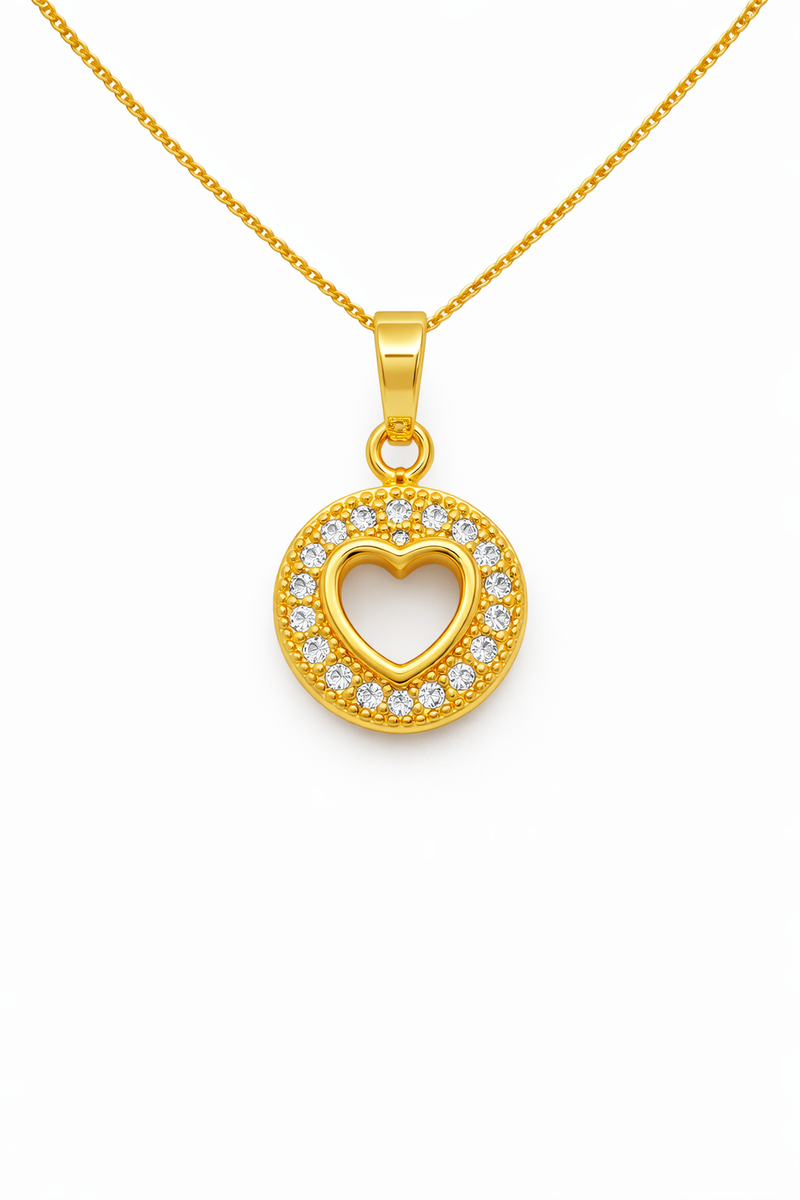 Gold necklace with a heart-shaped pendant on a white background