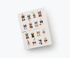 A birthday card featuring stylish illustrations of cats wearing party hats, sunglasses, and bowties, paired with a gold envelope.