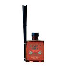 Joshua Tree reed diffuser with amber glass bottle and black reeds by Good & Well Supply Co., scented with lavender, cedar, and sage.