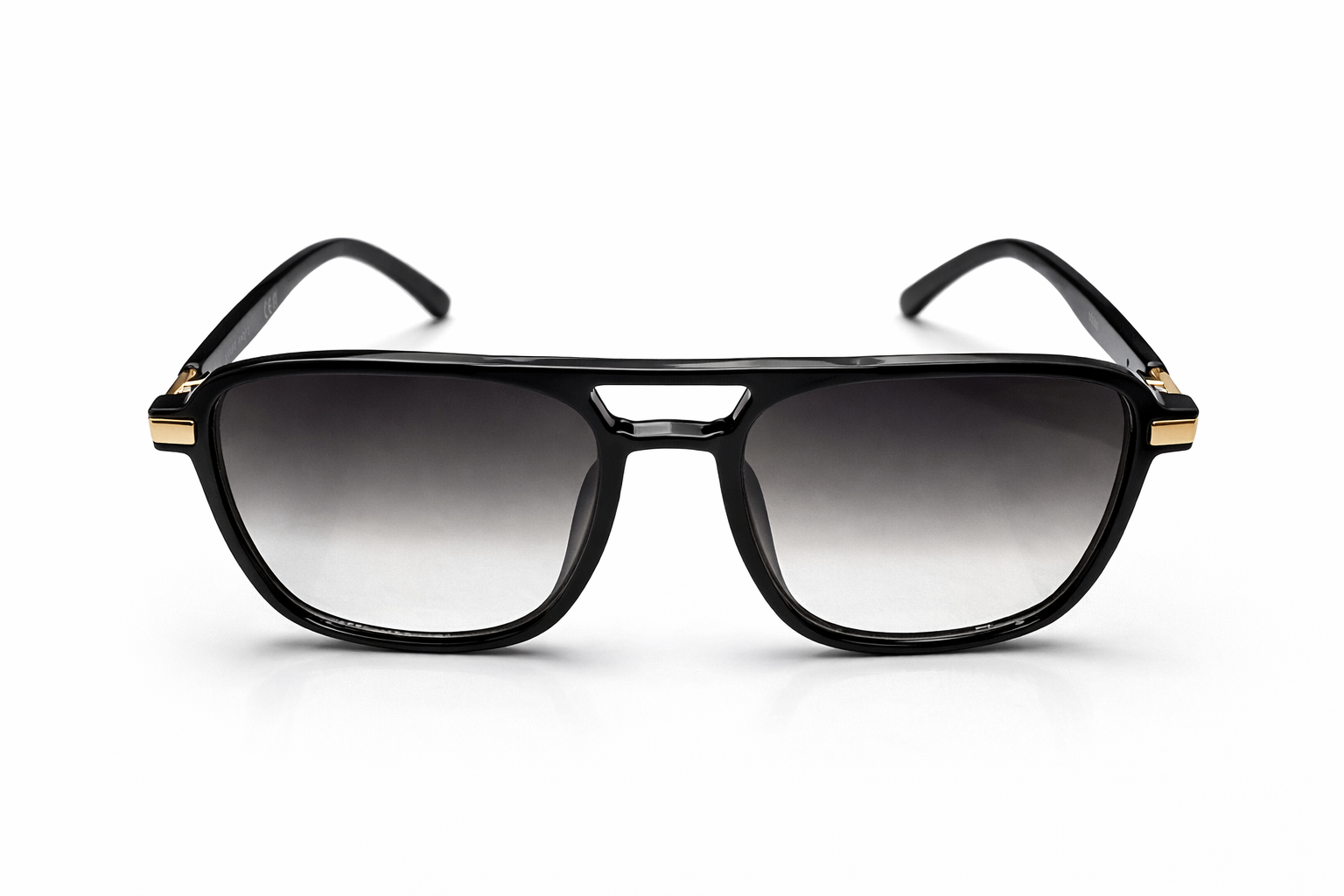 Black sunglasses with gold accents on a white background