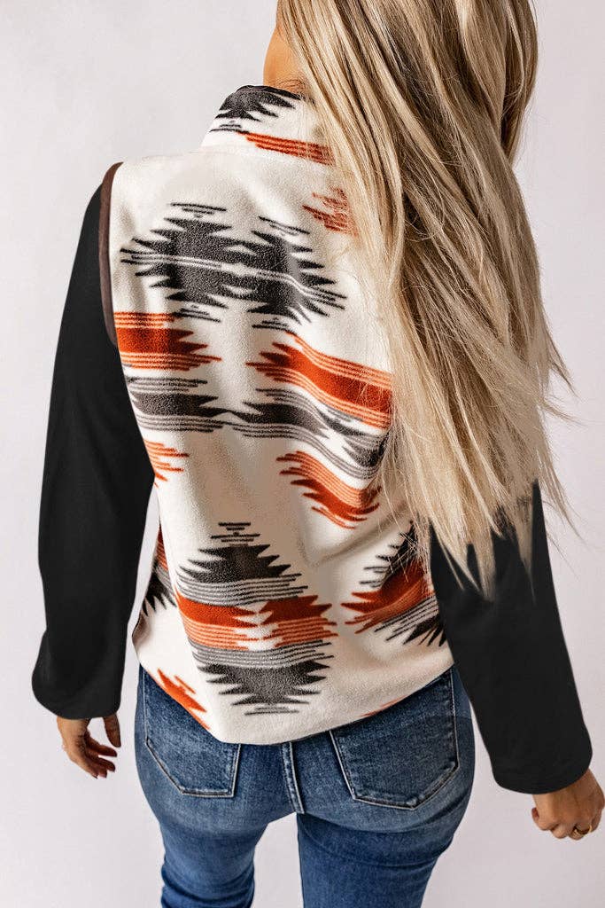 Model wearing an Aztec Western Fleece Vest Jacket with a bold pattern, snap-button front, and zippered pockets.