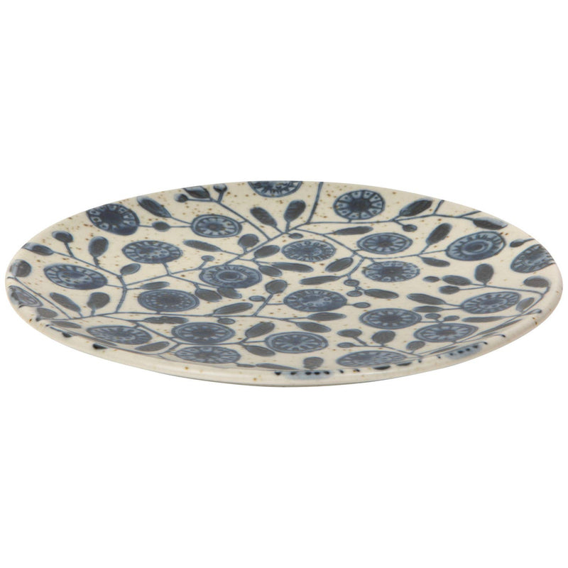 Ceramic plate with blue floral pattern on a white background