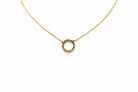 Gold necklace with a colorful circular pendant on a white background