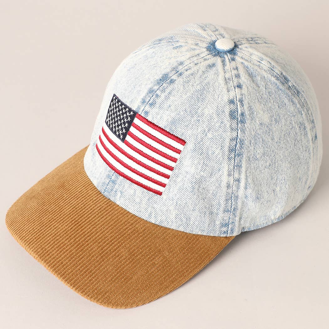 Denim cap with American flag patch on a beige background