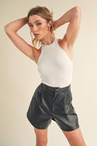 A high-neck tank top named "Nora".