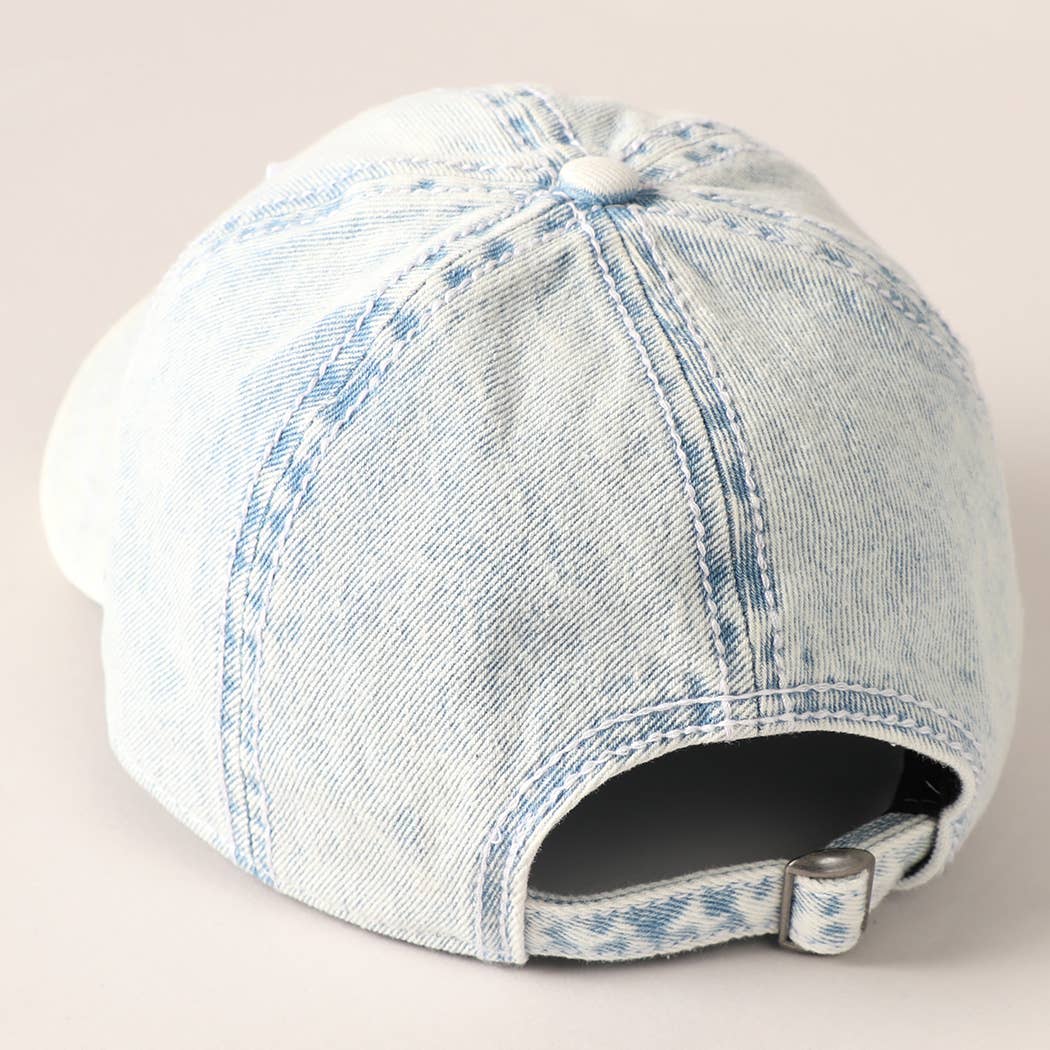 Light-wash denim baseball cap with embroidered American flag patch, ideal for 4th of July.